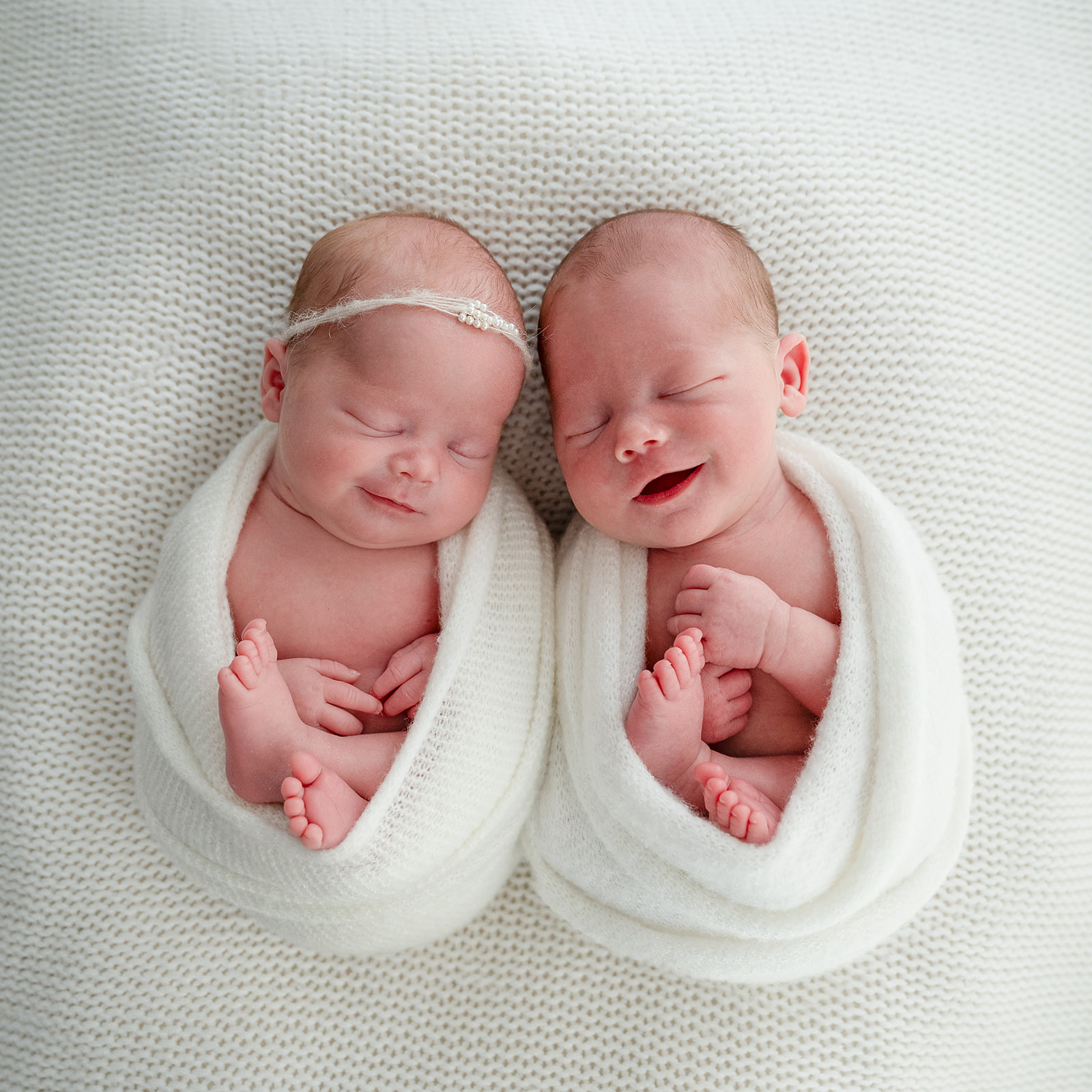 Newborn babies wrapped in white at Liv Photography Studio Photoshoot